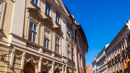 European street with old multi-storey buildings on a sunny day