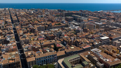 Obraz premium Aerial panorama of the city of Catania, Italy. It is the second largest city in Sicily. The Mediterranean Sea is in the background, on the horizon.