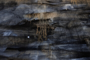 Abstract painting on canvas close-up. Paint drips.