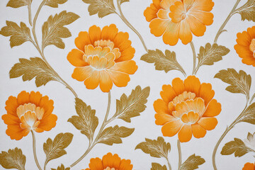 Warm, nostalgic retro floral pattern on vintage wallpaper. This orange flower and leaf background from seventies offers classic and beautiful home decor design