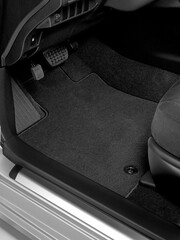 Luxury car floor mats in black fabric