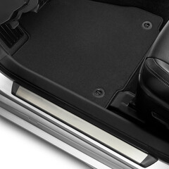 Luxury car floor mats in black fabric