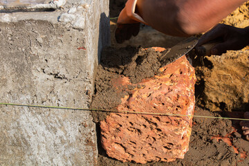 Aligning Brick Wall Using Masonry String Line