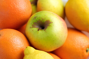 Fresh fruit assortment with green apple, oranges and lemon. Healthy nutrition concept