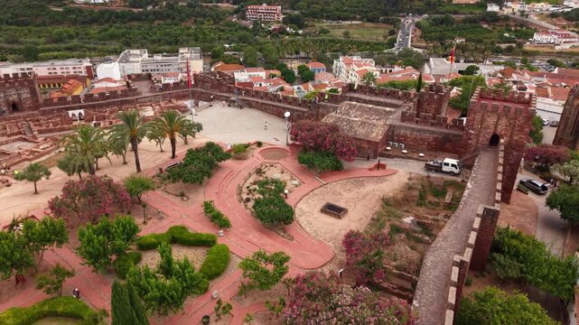 Silves castle overview in Algarve Portugal during the daytime featuring the architecture and surrounding landscape