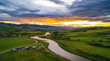 Scenic Aerial View of River Surrounded by Lush Green Hills