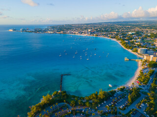 Pebbles Beach aerial view at sunset at Carlisle Bay in city of Bridgetown, Saint Michael, Barbados. This coast belongs to Bridgetown and Garrison UNESCO World Heritage Site.  © Wangkun Jia