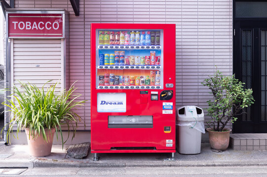 Tokyo, Japan -November 9  , 2024 :  Vending machines in Tokyo, Japan. Coca-Cola vending machine on a residential street