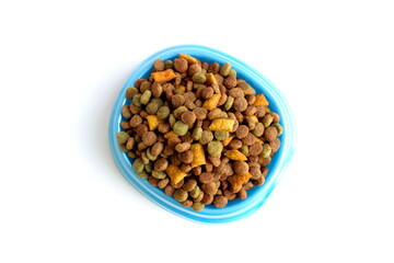 There is a bowl of dry pet food on a white background.	