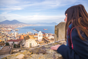 Woman gazes at Naples Italy with Mount Vesuvius in the background