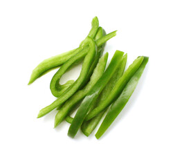Sliced green bell pepper in a bowl on white background