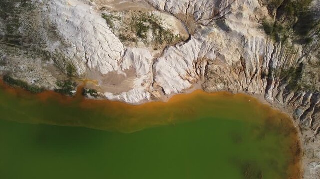 Waste rock dumps, artificial lakes in ilmenite quarry, aerial view