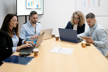 Business professionals collaborating in a corporate meeting room