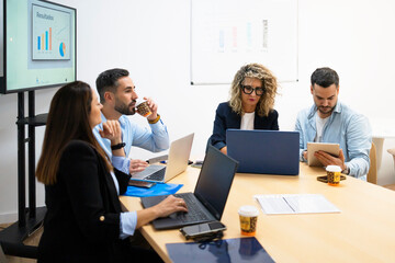 Business people collaborating in a modern office meeting