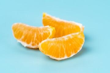 photo of tangerines on a blue background