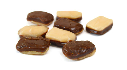 Caramel candies isolated on white background