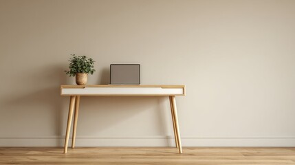 Laptop on wooden desk with plant against a neutral wall. Minimalist home office setup for work from home or creative space. Future color of the year 2026.