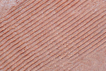 The texture of sugar or salt body scrub as a cosmetic background with the possibility of copying.