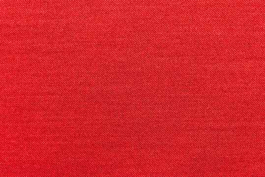 Texture of natural red fabric or cloth. Fabric texture  natural cotton or linen textile material.  Canvas background. Decorative fabric for curtain, furniture, walls, clothes