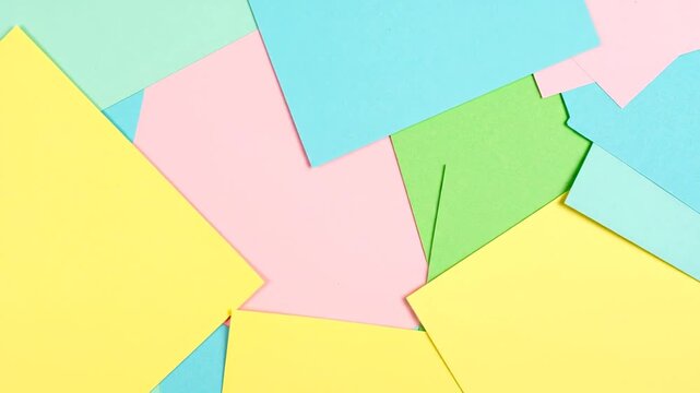 A geometric composition with overlapping paper rectangles in pastel colors