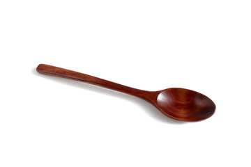 There is a brown wooden spoon on a white background.