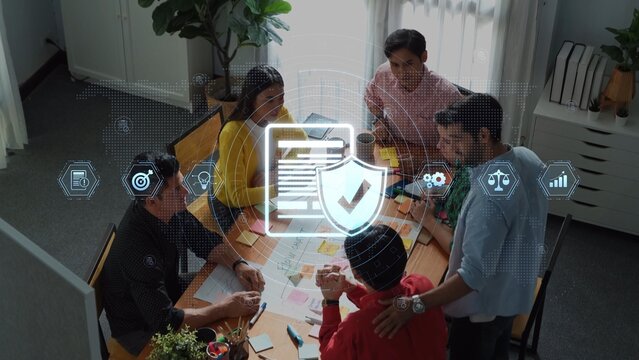 A diverse group of professionals collaborates in a modern office setting, engaging in strategic discussions while incorporating digital elements for security and compliance. Raster