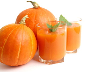 There is a pumpkin with juice on a white background.	