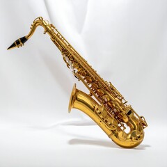 A golden saxophone, angled, against a soft, white backdrop
