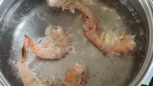 Color changing of king prawn tails during cooking, time lapse