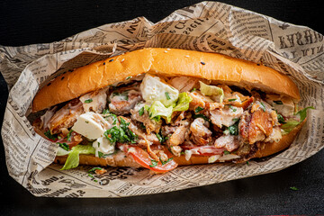 This tasty sandwich features juicy chicken, crisp lettuce, and flavorful dressing