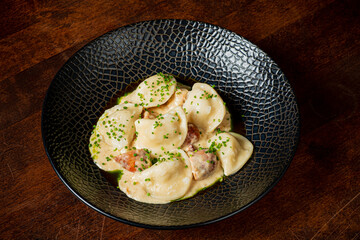 Delightful dumplings coated in rich sauce create a comforting and inviting meal experience