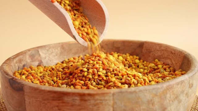 Bee pollen in a wooden bowl for holistic health