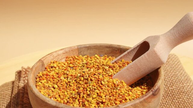 Bee pollen in wooden bowl for holistic health