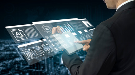 A businessman engages with a futuristic digital interface that showcases data analytics and technology trends against a dynamic city skyline backdrop. Gantry