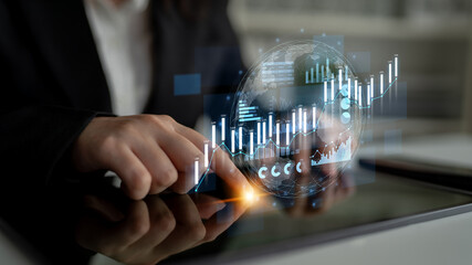 A focused business professional interacts with a digital tablet, displaying global financial data, charts, and graphs to analyze trends and make informed decisions. Scalp