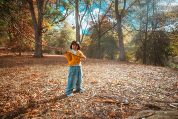 A joyful and playful child reveling in the warmth of a sunny autumn day at the park