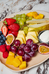 A colorful platter of ripe fruits adds joy to a cheerful gathering