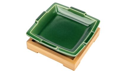 Square green ceramic plate isolated on a wooden stand PNG, elegant serving dish for appetizers and...