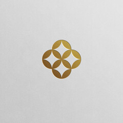Geometric flower pattern logo in luxury gold shades. Sleek and modern design can fit various industries.	