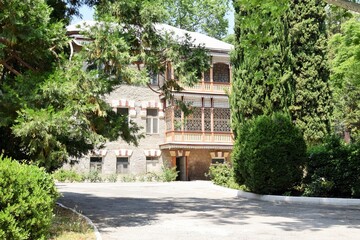 Summer landscape. A beautiful building in the South Park.