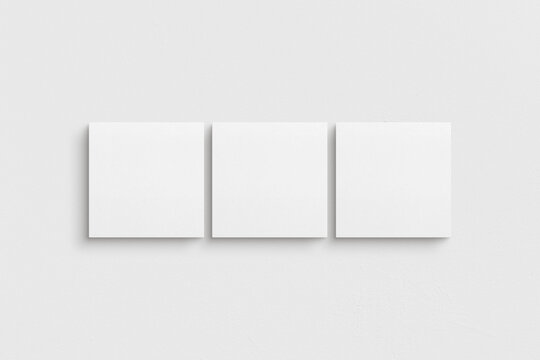 Canvas mockup 1:1 square. Set of three square canvases. Clean, modern, minimalist, bright gallery wall mockup, set of 3 canvases on a white wall.