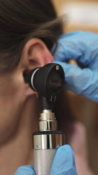 ENT doctor. Ear. Ear canal. Slow motion. Vertical video.High quality 4k footage