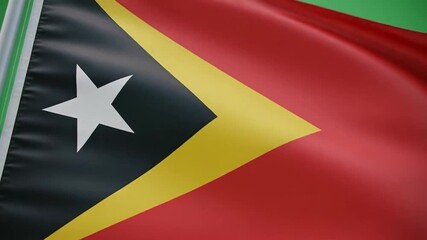 East Timor flag waving on green background
