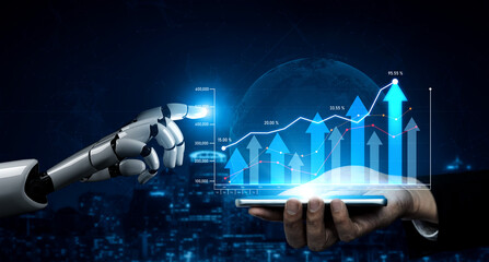 A futuristic robot hand reaches out to interact with data analytics graphs displayed on a mobile...
