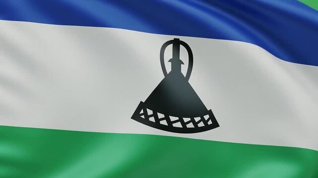 Lesotho flag waving on silver pole against green background