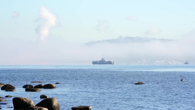 Seabus Ferries in Burrard Inlet Fog 4K UHD.A Seabus ferry crosses Burrard Inlet in the fog. 4K, UHD.
