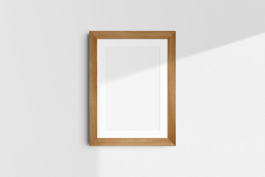 Frame mockup 5x7, 50x70, A4, A3, A2, A1. Single cherry wood frame mockup. Clean, modern, minimalist, bright. Portrait. Vertical. Passepartout/mat opening in 2:3 aspect ratio. Shadow overlay.