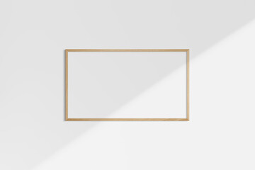 Horizontal frame mockup 16:9, 9:16 landscape. Single oak wood frame mockup. Clean, modern, minimalist, bright. Shadow overlay.
