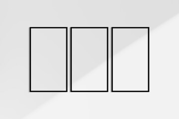 Frame mockup 9:16. Set of three thin black frames. Gallery wall mockup, set of 3 frames. Clean, modern, minimalist, bright. Portrait. Vertical. Shadow overlay.