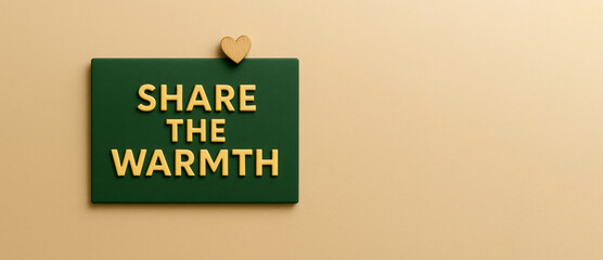 Seasonal holiday giving charity message on green board with beige background